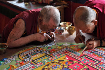 Buddhist monks making sand mandala